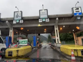 ASFINAG Digitale Streckenmaut self-service toll station in Austria with toll booths and €8.20 toll fee sign