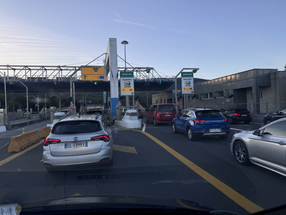 Italian autostrada toll station at Barberino with cars queuing at biglietto ticket lanes
